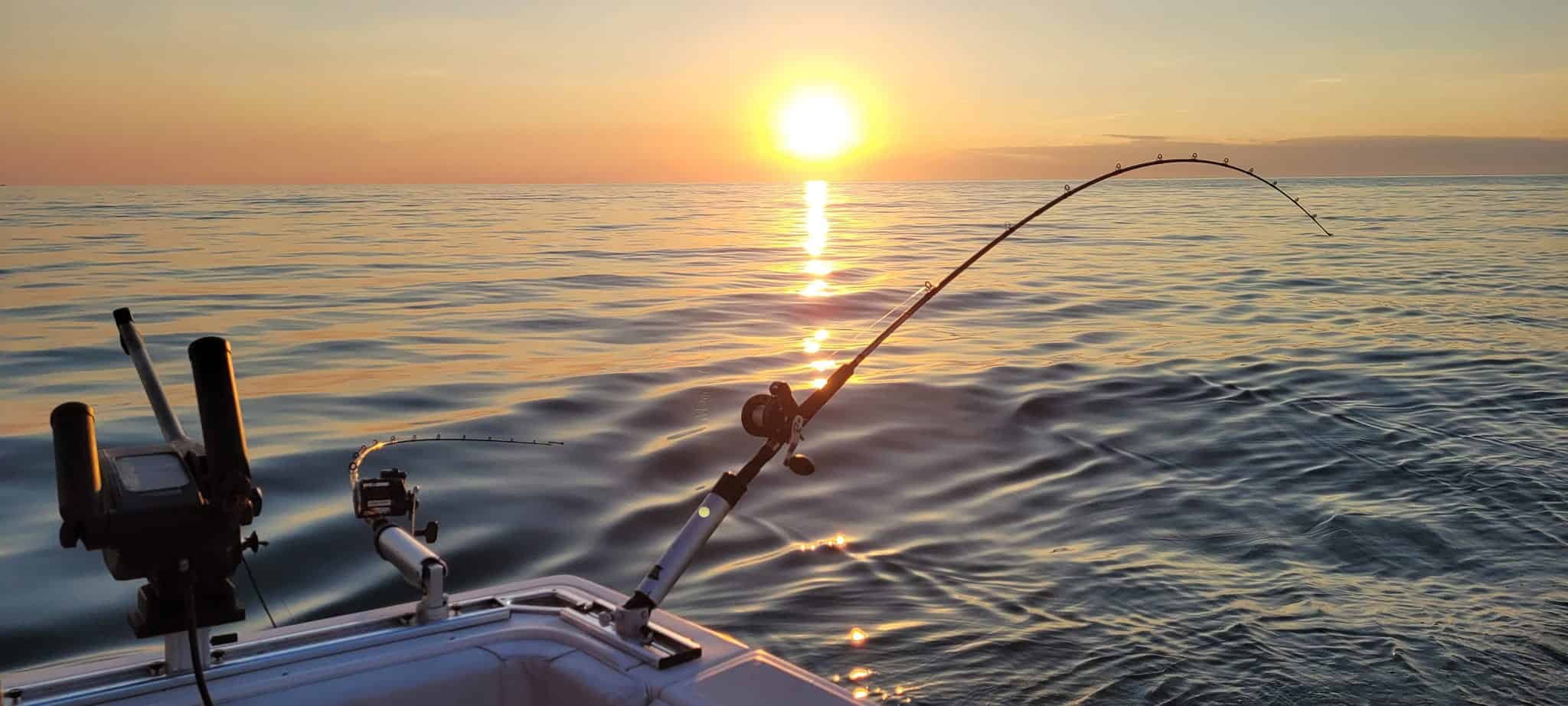 3rd Alarm Charters - Lake Sunrise on a Boat with Fishing Gear